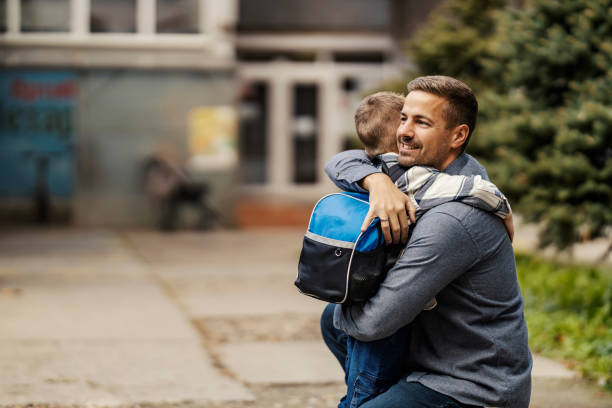 istock Father and son hugging on kindergarten entrance. 2060446704