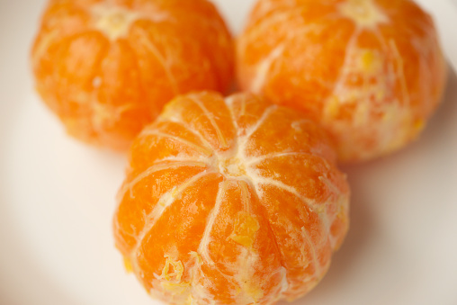 Three mandarins peeled.