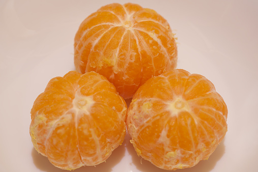Lemon, orange and grapefruit on blue background with copy space.