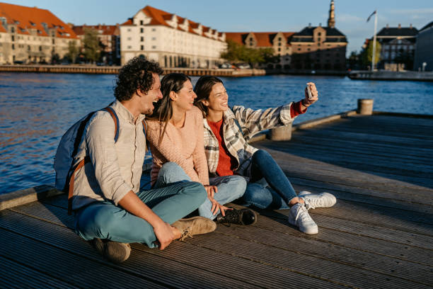 istock Three Young Friends Taking Selfies On The Dock In Copenhagen In Denmark 2060496040