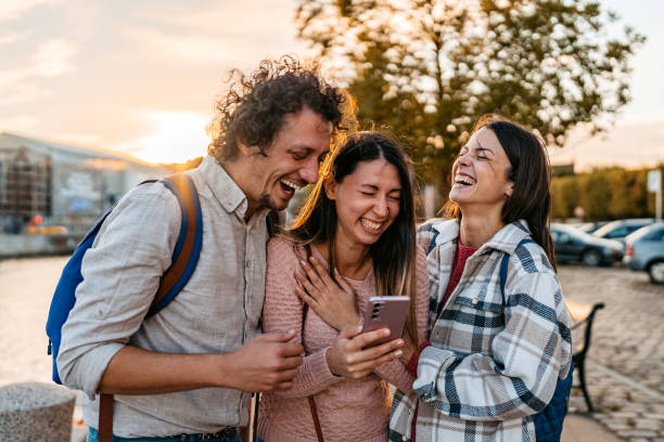 istock Three Young Friends Using Smart Phone In Copenhagen In Denmark 2060509431