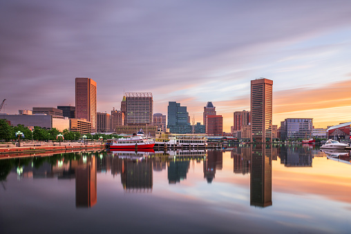 Baltimore, Maryland, USA skyline on the Inner Harbor at dawn.