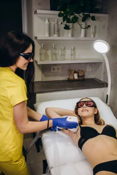 Smooth skin under the arms. Woman on laser hair removal.