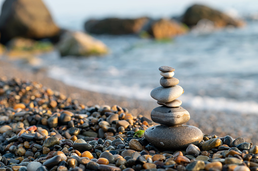 stone pyramid on the beach, symbol of harmony