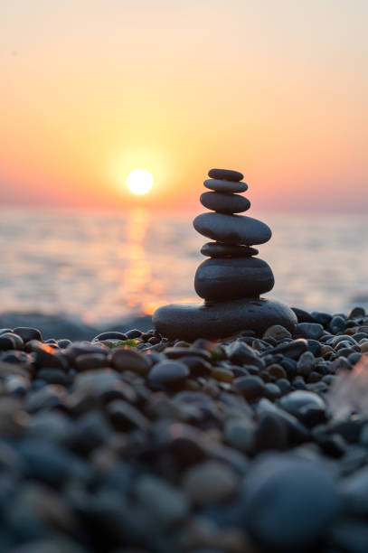 istock Balancing stones on the seashore at sunset 2060532938
