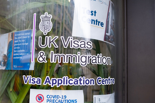 white door with text UK Visas, Immigration Visa Application Centre, in Berlin, Germany - February 19, 2024