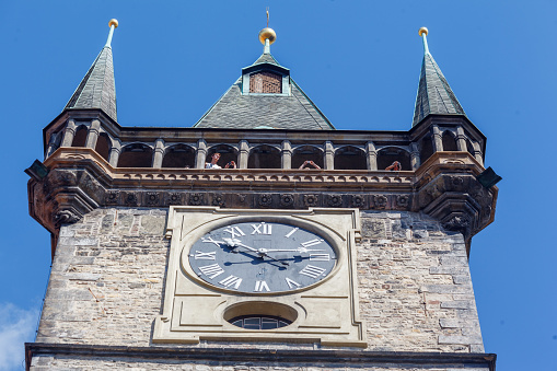 Detail of the old Town hall clock tower in Staromestke Namesti facade in Prague Czech Republic