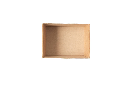 Brown recycled cardboard box isolated on white. Open gift box. Rectangular empty paper container top view.