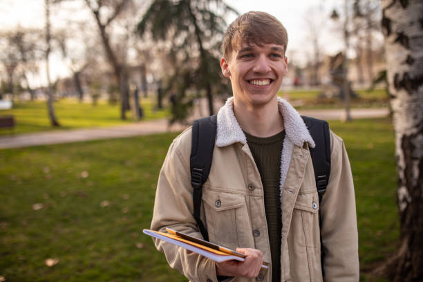 istock Portrait of a young man in a park 2060555427