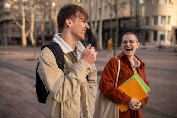 istock Young student couple walking in a park together 2060556492