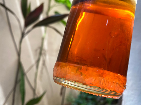 fake honey in a container bottle. Close up