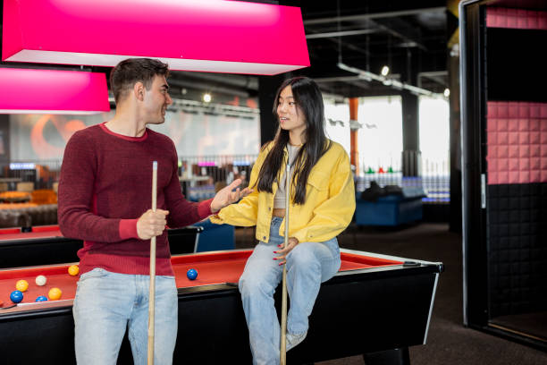 istock multiracial couple generation z playing snooker 2060575660