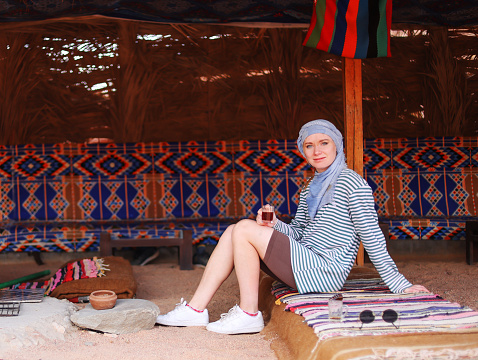 girl tourist visiting Egyptian Bedouins