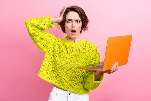 istock Photo of stressed young funny girl hand touch head confused her code broken nothing launches correct isolated over pink color background 2060586965