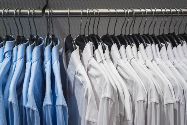 istock Blue and white shirts on hangers 2060599212
