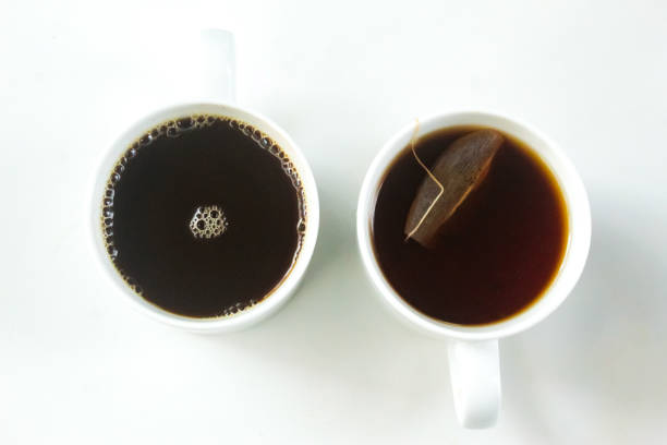 a cup of coffee and a cup of tea on a white background