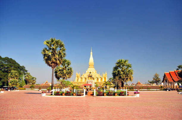 Vientiane, Laos: the golden Pha That Luang stupa, believed to contain a hair of Buddha - a lotus-bud design, the national symbol of Laos, first erected in the 12th century by the Khmers, it has been rebuilt several times, the last in 1930. Only the pinnacle is covered in real gold; the remainder of the stupa is painted a gold color.
