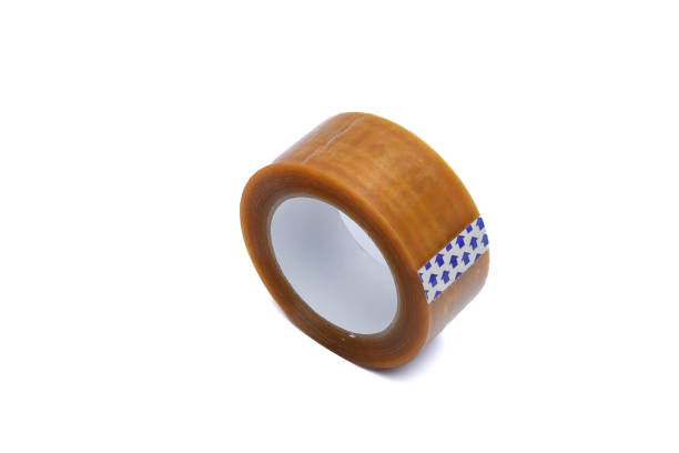 Isolated single roll of wide adhesive packing tape on white background