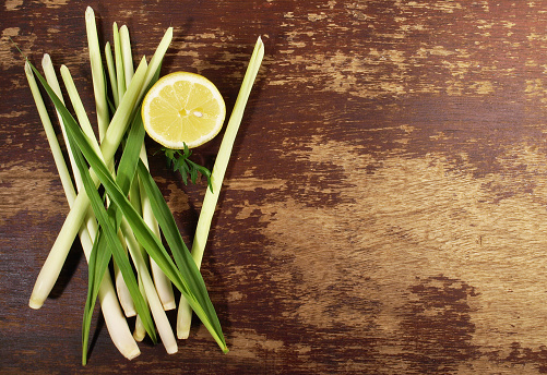 Lemon Grass with Leaves and Lemon on wooden Background