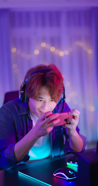 istock asian guy smartphone cyber sport 2060654795
