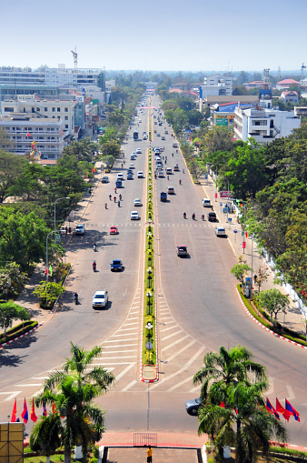 Vientiane, Laos: Lane Xang Avenue (Thanon Lansang, former Avenue de France) the city's main street and the country's most important thoroughfare - looking SW from Patuxai square towards the Presidential Palace, the Mekong river and the border with Tahiland.