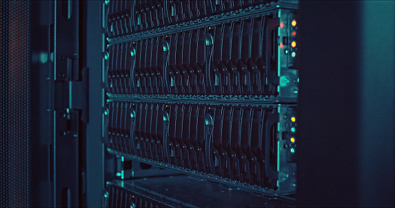 Computer engineering, information or hardware in server room or cyber security for protection of company. Business, IT support or modern high tech internet data center and rows of racks with network