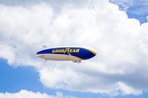 Goodyear Zeppelin, airship in Friedrichshafen.\nHe takes off on a sightseeing flight over Lake Constance and the Alps. The passengers enjoy the beautiful landscape