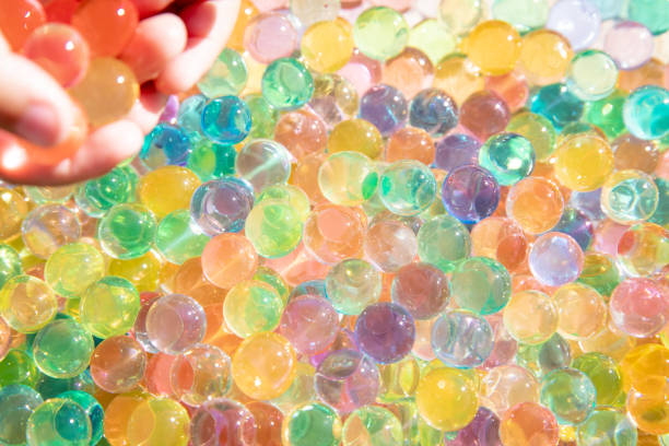 istock Colored balls of hydrogel touch children's hands. Sensory sensations. 2060681808