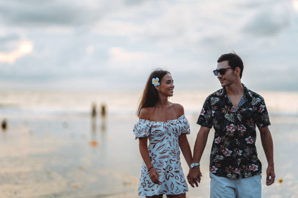 istock Honeymoon Couple Walking On Double Six Beach Bali 2060721457