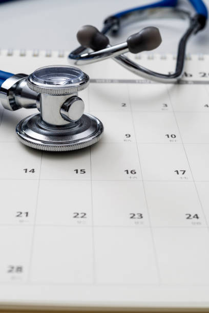 istock Stethoscope and pen on a calendar 2060723118