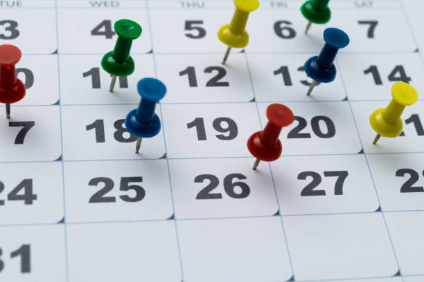 istock Thumbtack pins on a calendar 2060723431