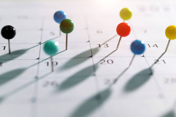 istock Colored pins on the calendar 2060724184
