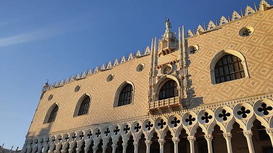 Piazza San Marco in Venice in Italy, Ducal Palace facade with blue sky at the sunset