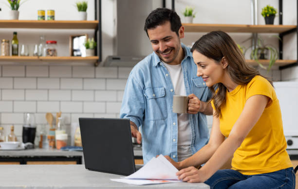istock Couple at home paying bills online 2060736782
