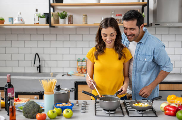 istock Couple enjoying cooking together at home 2060736789