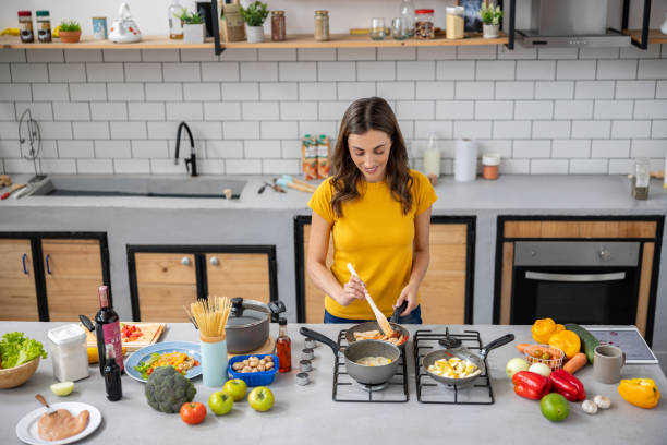 istock Woman cooking at home 2060736793