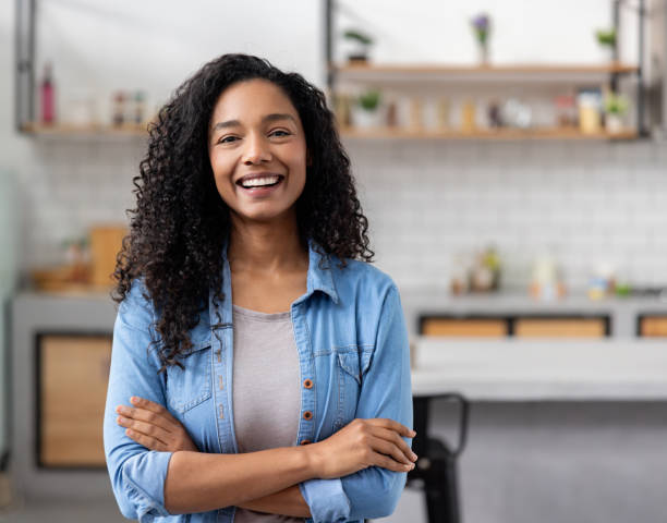 istock Woman smiling in the kitchen at home 2060737402