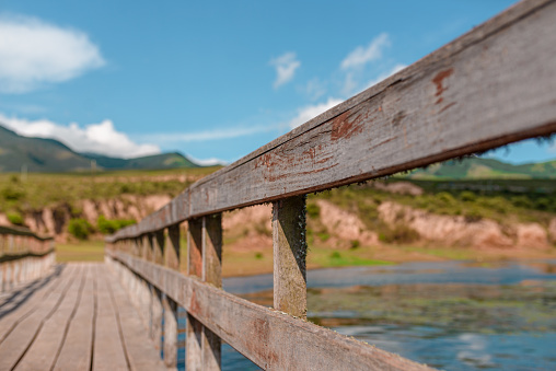 bridge on lake with mountains background with copy space