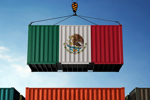 Mexico trade cargo container hanging against clouds background