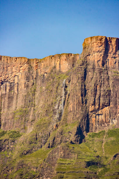 Distant view of the top of the Tugela Falls, in the Drakensberg Mountains of South Africa. The Tugela Waterfall is one of the world’s most impressive waterfalls. It is a step waterfall consisting of five different steps, with a total length of 989 m, making it the world’s tallest waterfall.