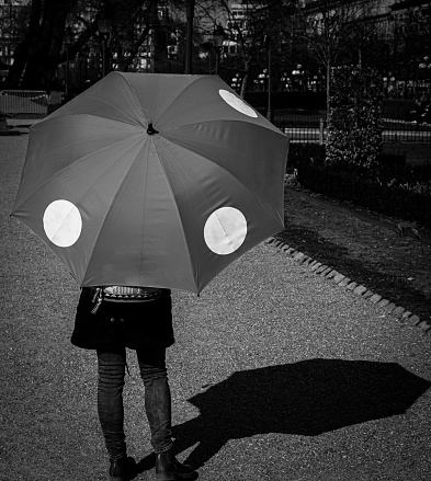 Rare view of a person holding a umbrella