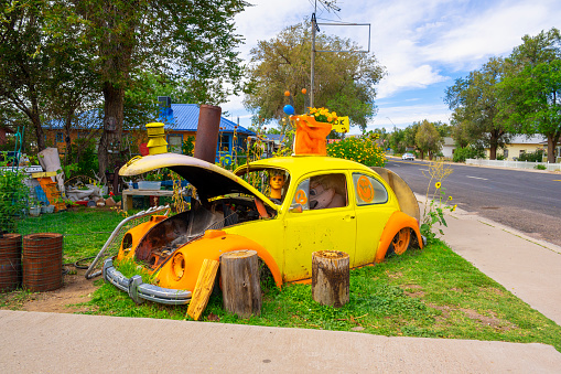 Seligman, Arizona, United States - September 22, 2023: Vintage Yellow Volkswagen in front of a gift shop