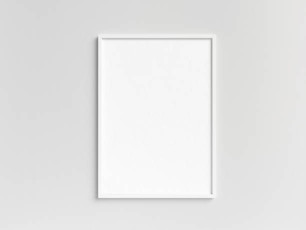 istock Empty white photo frame template hanging on the wall 2060751017