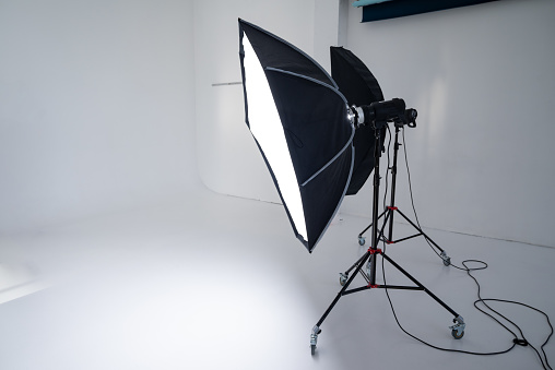 studio flashes on the background of a white cyclorama.