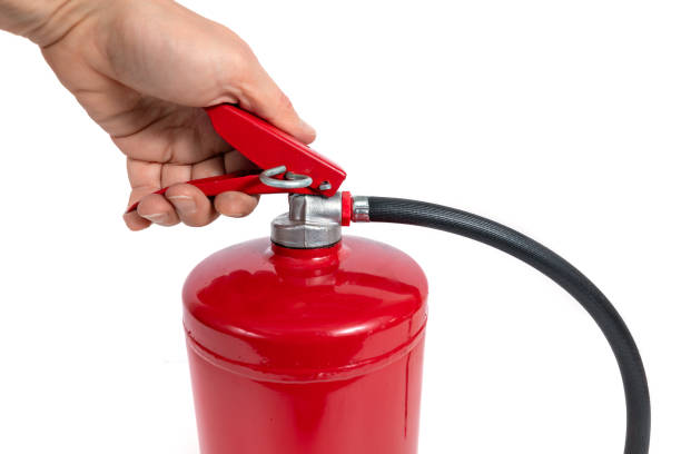 istock A red fire extinguisher with black hose on white background 2060757211
