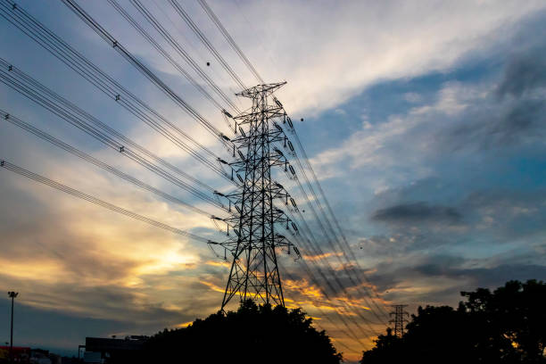 istock High voltage pole silhouette on sunset sky background. 2060757260