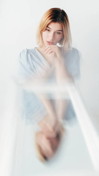 Bipolar disorder woman defocused mirror reflection