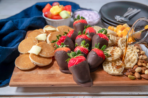 Chocolate dipped strawberries charcuterie board