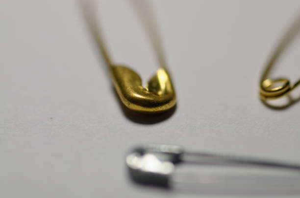 istock gold paper clip in close-up. 2060758323
