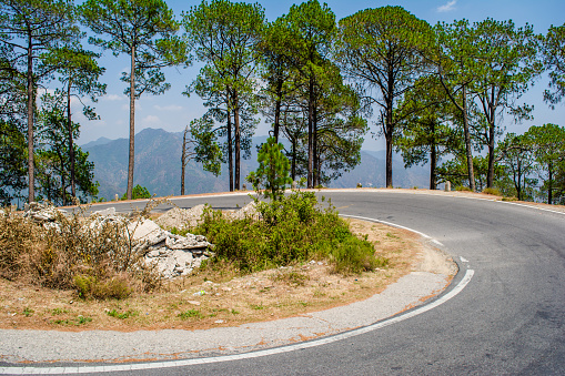 Beautiful  curvy Road on the mountains of Lansdowne, Uttarakhand. Aerial view of amazing curved road through the mountains.